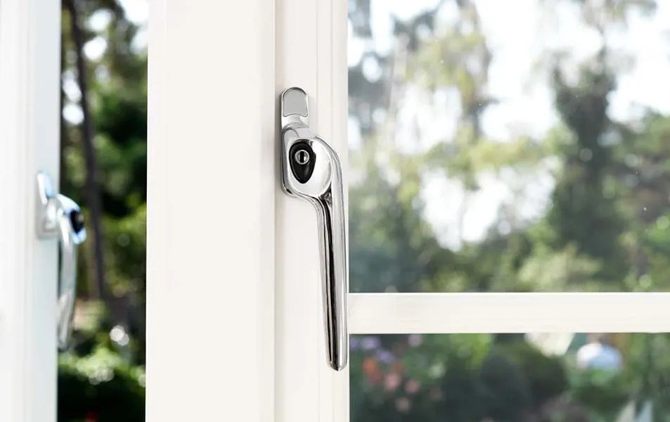 Chrome window handle on white Everest conservatory window