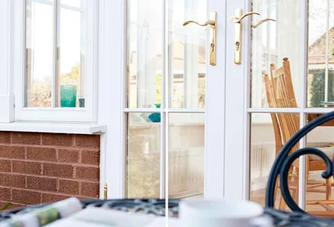Everest conservatory white double doors with gold handles