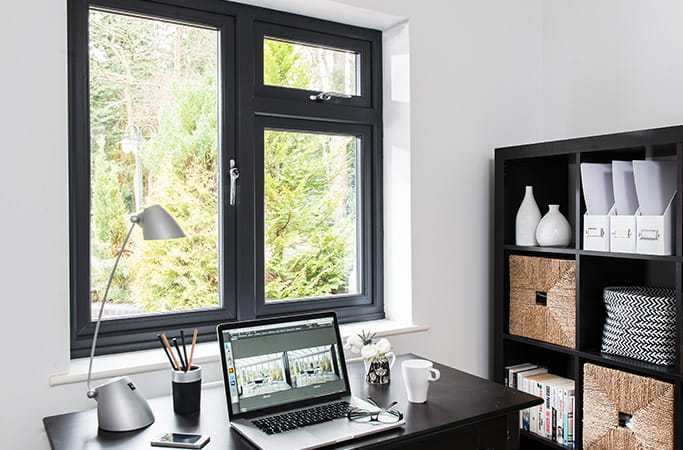 Everest black window with laptop on desk