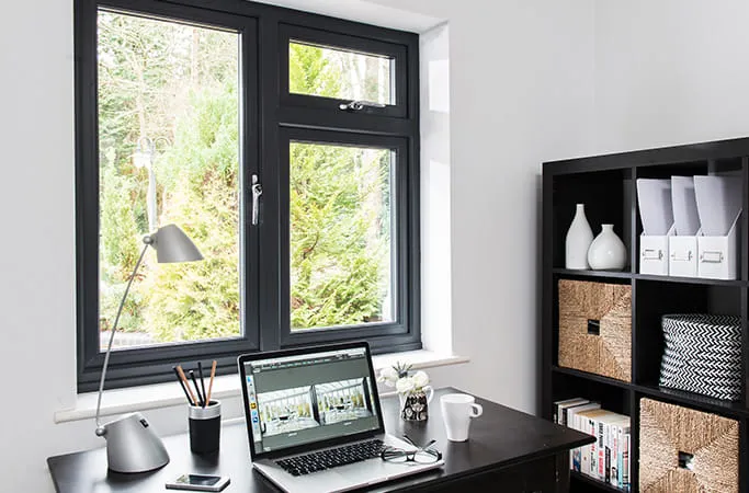 Everest black window with laptop on desk