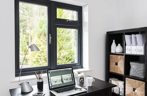 Everest black window with laptop on desk