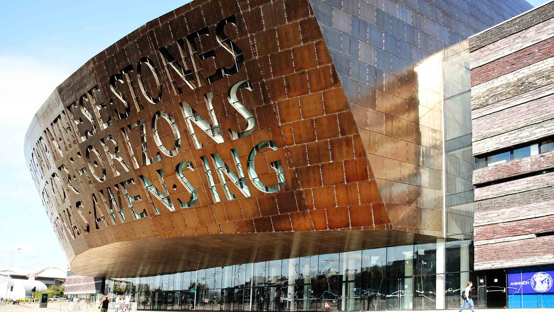 Copper building with words carved into the facade